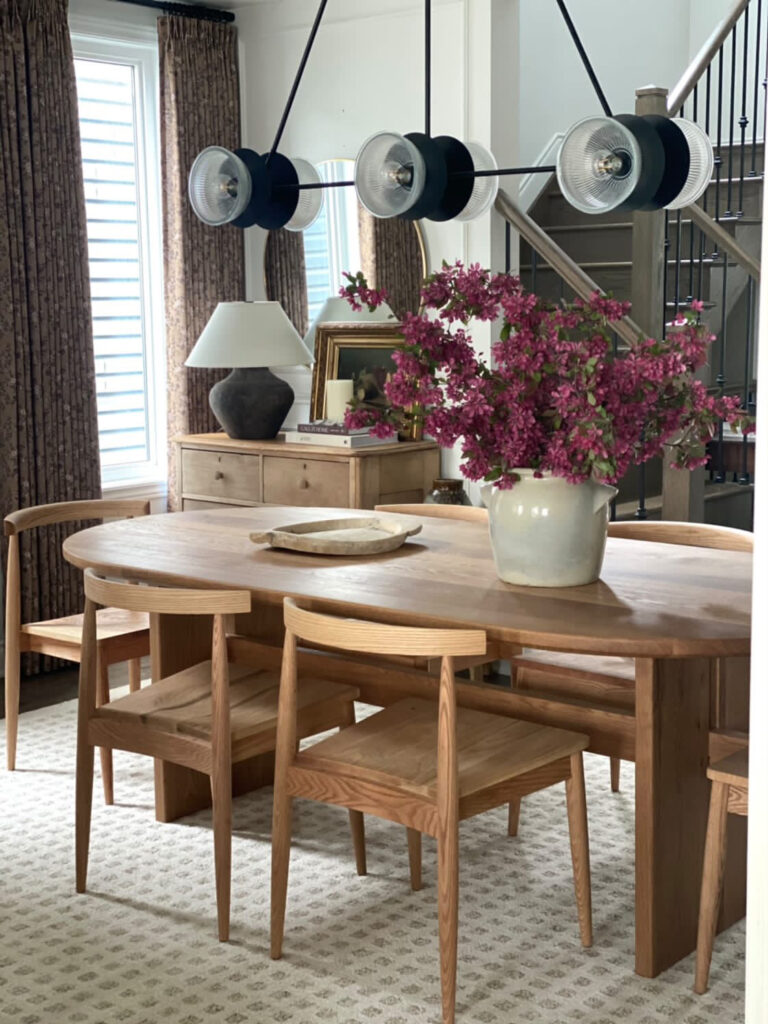 Stylish Ottawa interior with green shelving, plants, and contemporary design elements highlighting custom live edge tables.